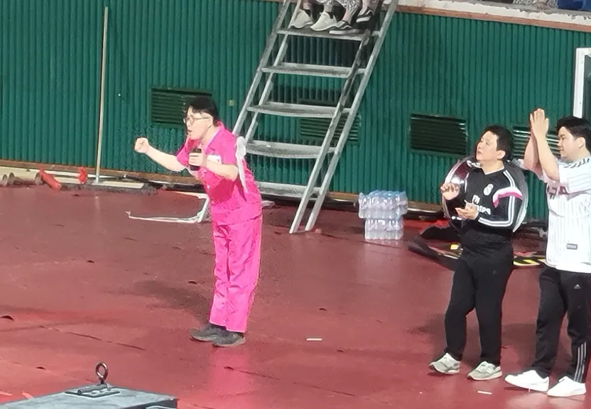 a group of people standing on top of a stage