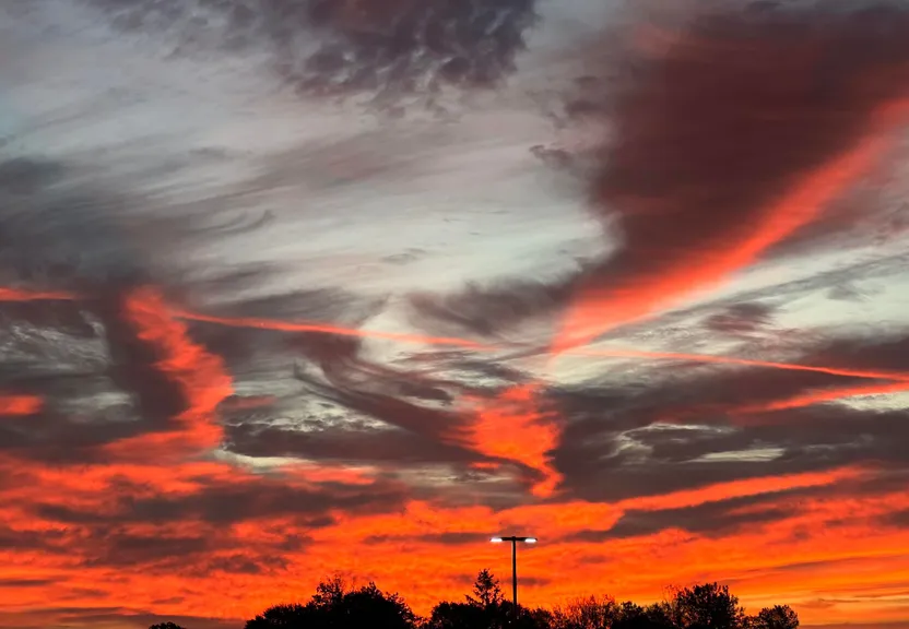 a red sky with some clouds in the background