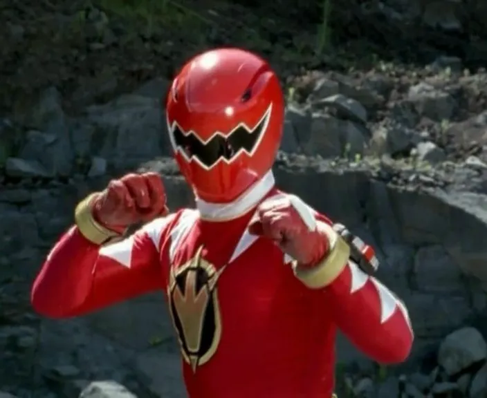 a man in a red power ranger costume