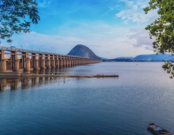 a long bridge out of Legos over a large body of water. make the bridge out of Lego