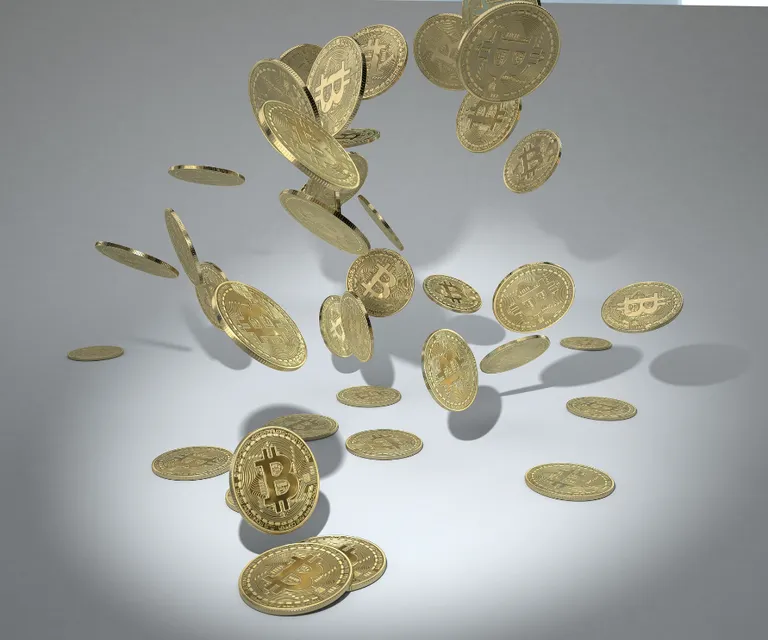 a bunch of coins falling into the air