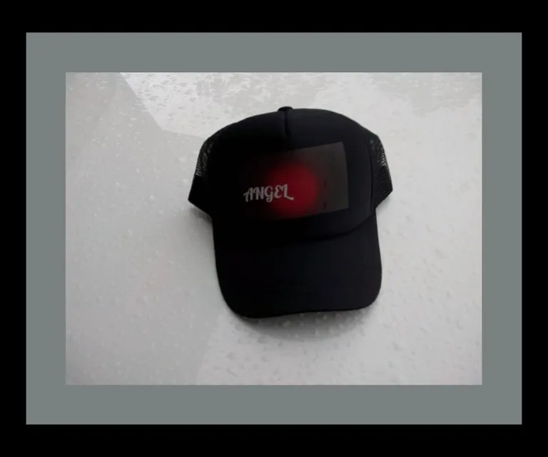 a black hat with a red light on it