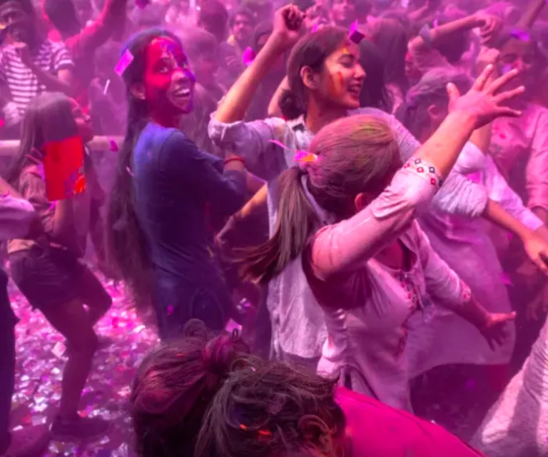 a group of people with colored paint on their faces