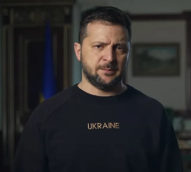 a man in a black shirt with the word ukraine on it