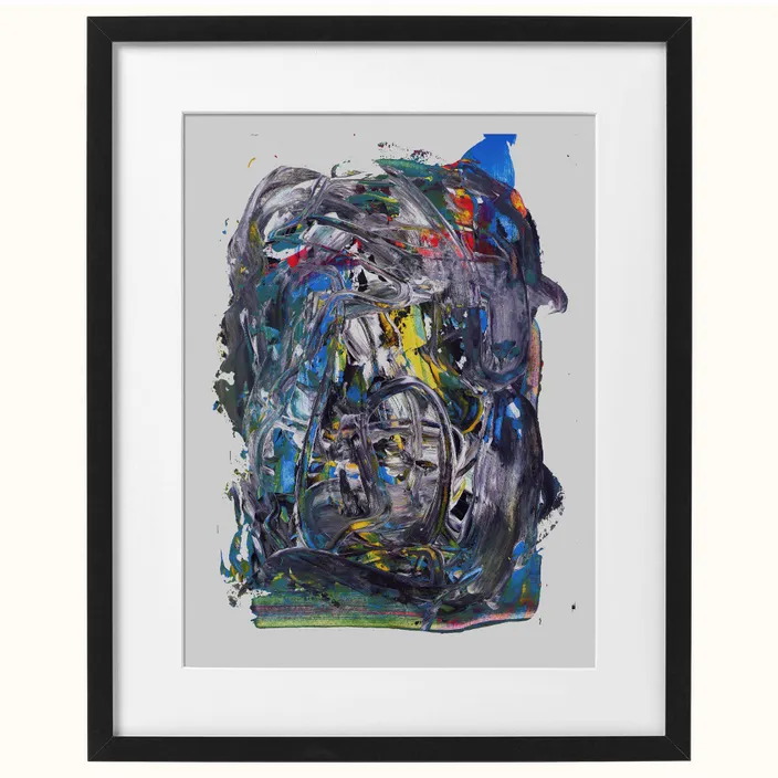 a painting with a black frame on a white wall