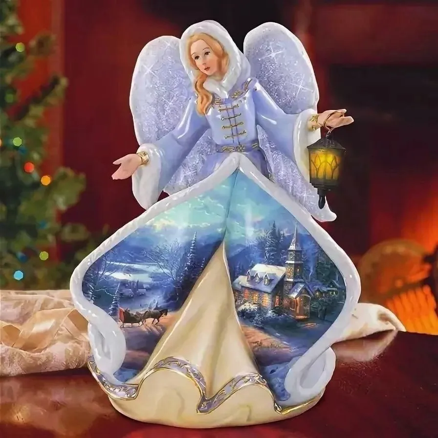 a christmas angel figurine on a table