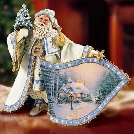 a figurine of a santa clause holding a sign