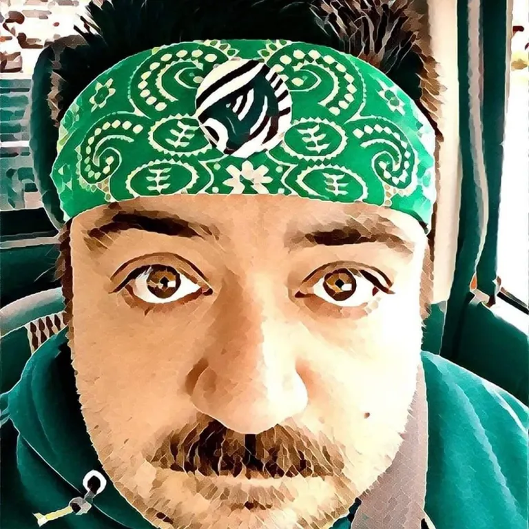 a man with a green bandana on his head. forehead, photograph, eyebrow, green, cap, beard, eyelash, eyewear, cool. trippy, psychadelic