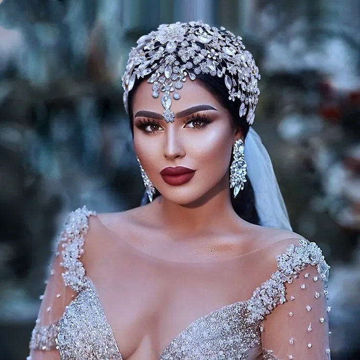 a woman wearing a bridal gown and a veil