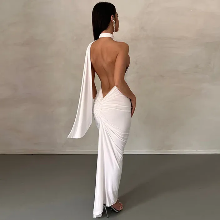 a woman in a white dress is standing back to back