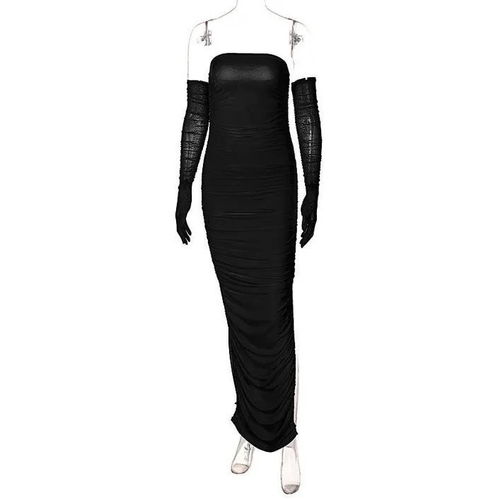 a woman in a black dress with long sleeves
