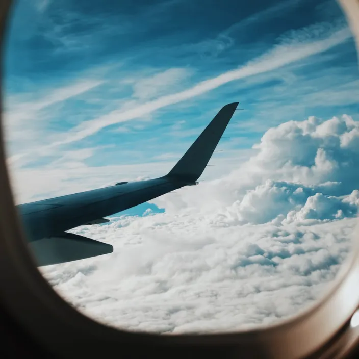 a view of the wing of an airplane through a window