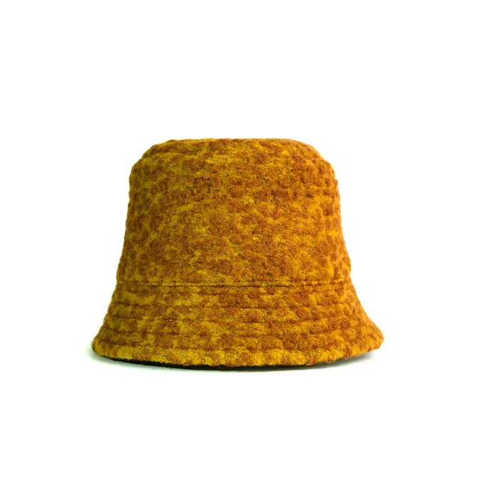 a yellow hat is shown against a white background