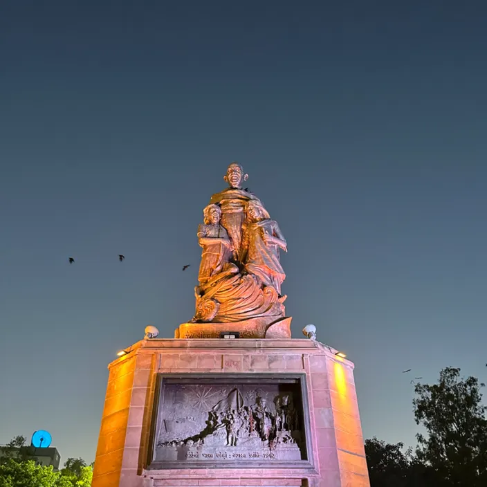 a statue of a man holding a child in his arms