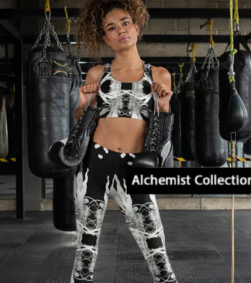 a woman in a black and white outfit standing next to a punching bag