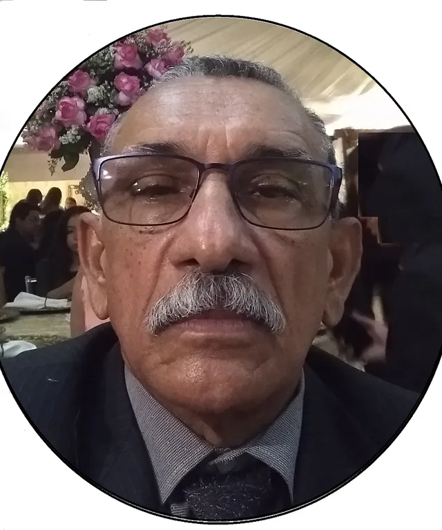 a man wearing glasses and a suit and tie
