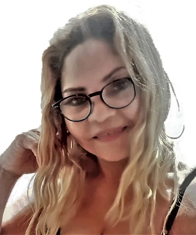 a close up of a person wearing glasses