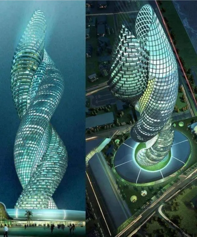 a spiral shaped building in the middle of a body of water