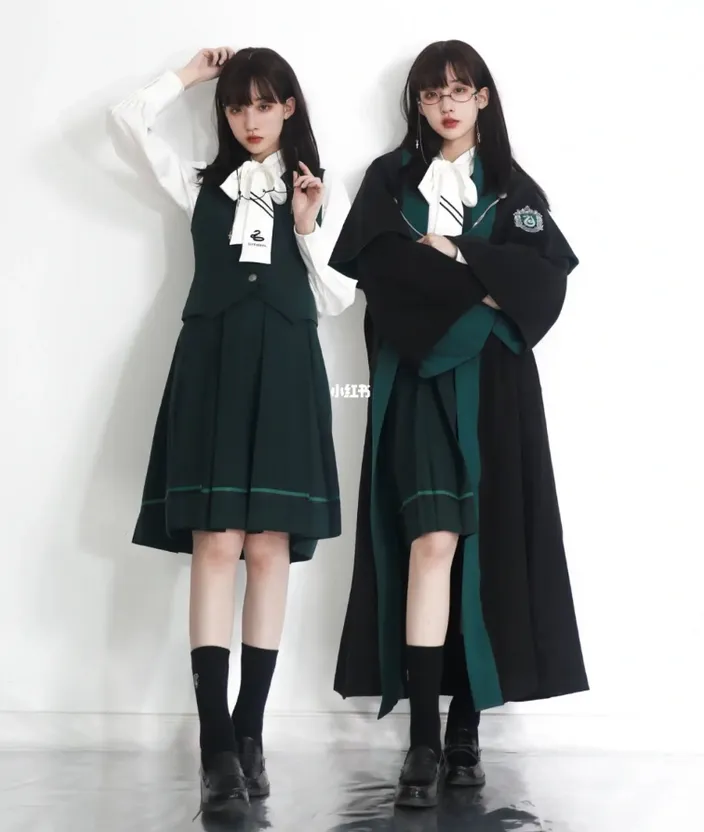 two young women dressed in school uniforms standing next to each other. clothing, footwear, shoe, neck, sleeve, gesture, collar, headgear, fashion design, formal wear