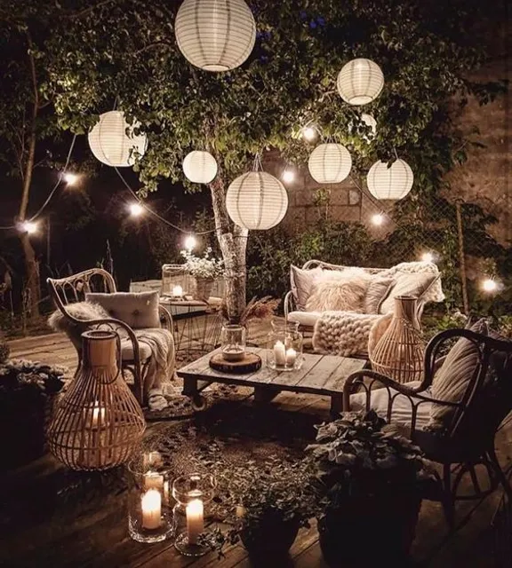 A patio with a lot of glowing, opulent lights hanging from the ceiling. use a silhouetted effect to create a glowing, opulent atmosphere