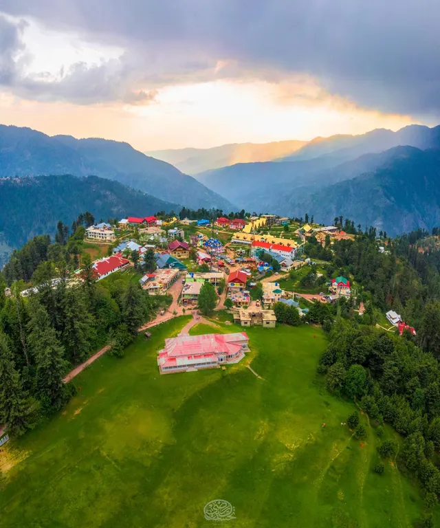 an aerial view of a village in the mountains