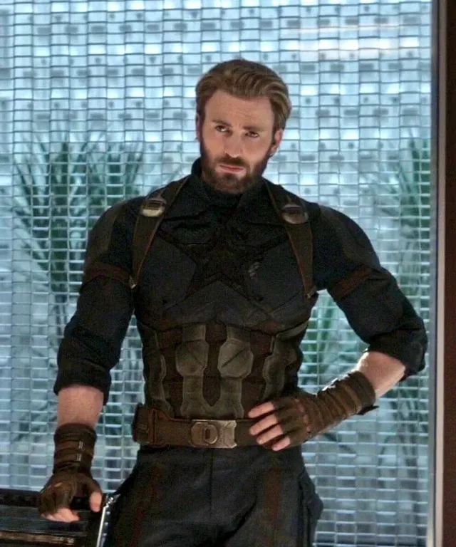 a man in a costume standing in front of a window