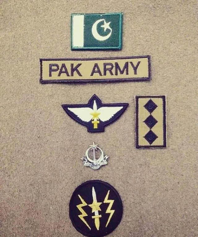 a group of patches and badges on a wall