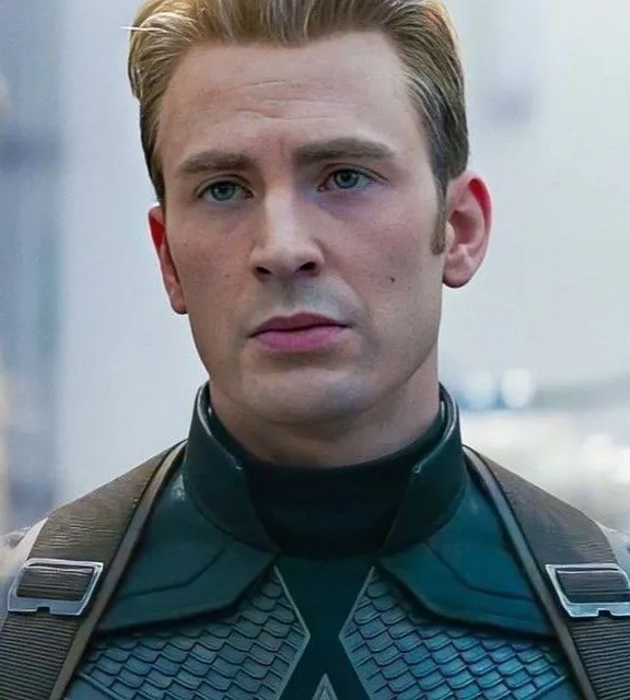 a close up of a person wearing a suit