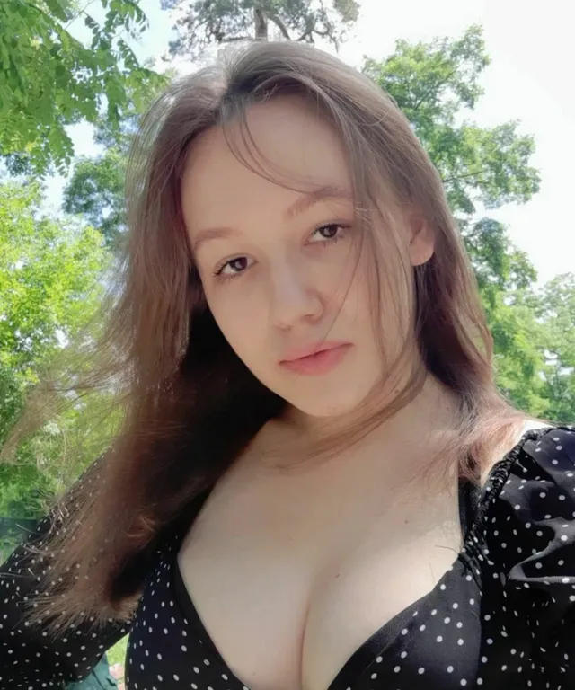 a woman with big breast posing for a picture