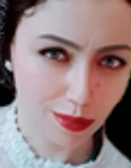 a close up of a person wearing a necklace