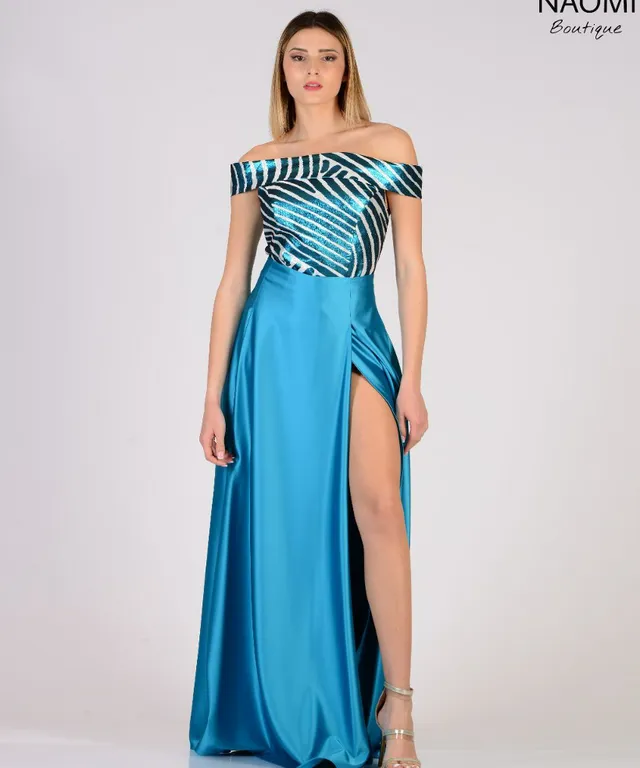 a woman in a blue dress with a slit