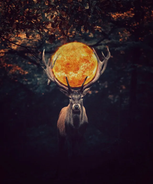 a deer with a glowing orb on its antlers