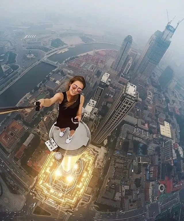 a woman flying through the air while riding a skateboard