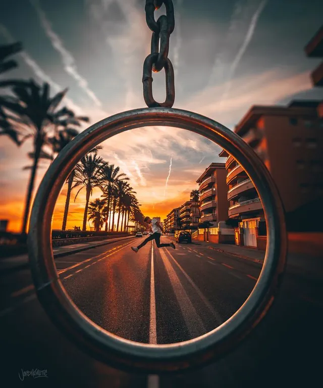 a person riding a skateboard on a city street