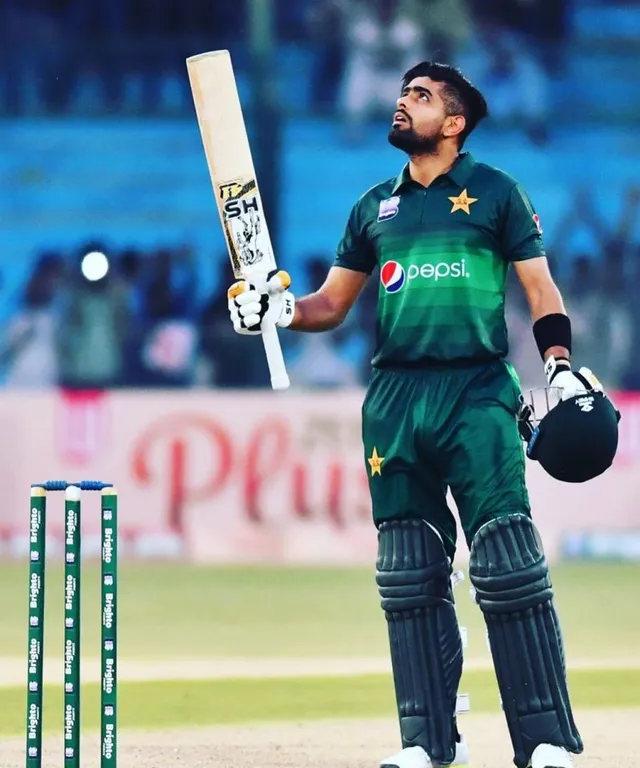 Babar Azam  holding a bat after doing century make him look like a real Babar azam