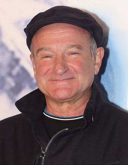 a man wearing a black jacket and a hat