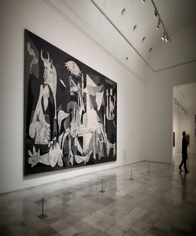 a large black and white painting on a wall