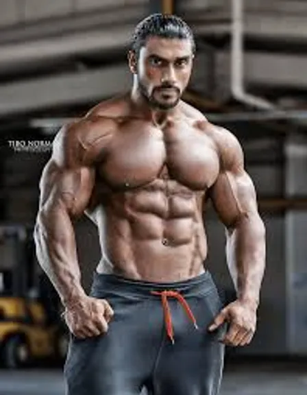 a man with no shirt and no shirt on posing for a picture