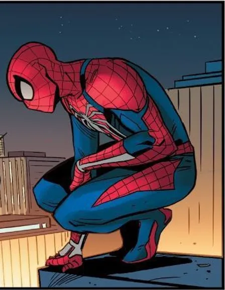 a spider man sitting on top of a roof