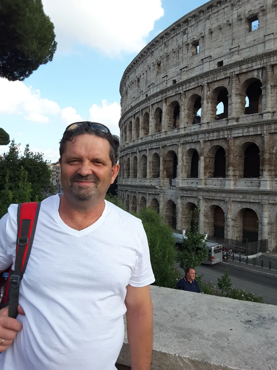 a man standing in front of an ancient building