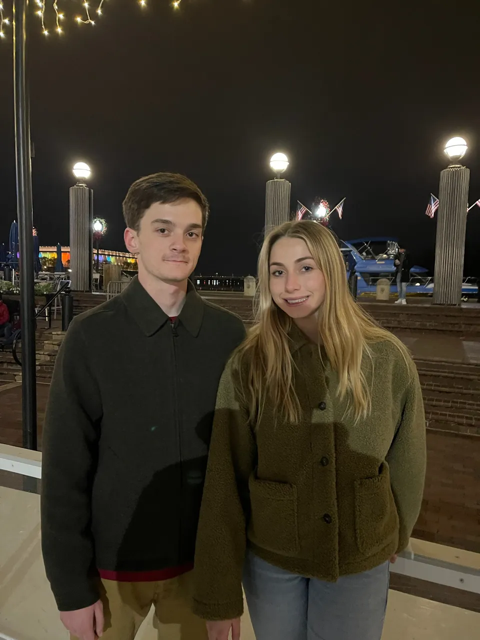 Couple in Prada strolling through a snowy park