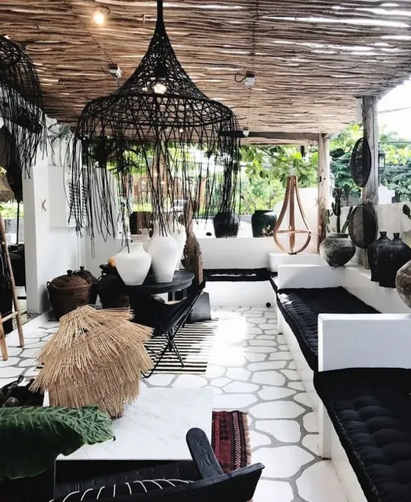 a room filled with lots of black and white furniture