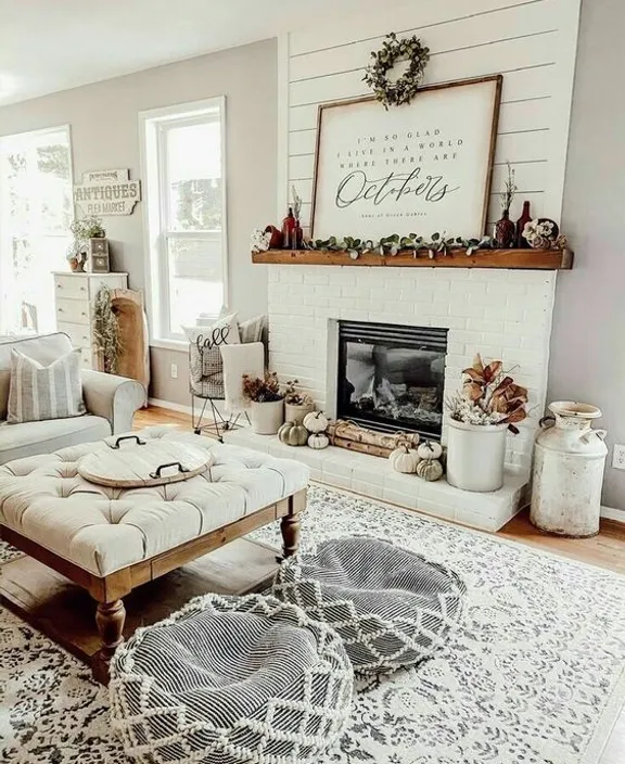 a living room filled with furniture and a fire place