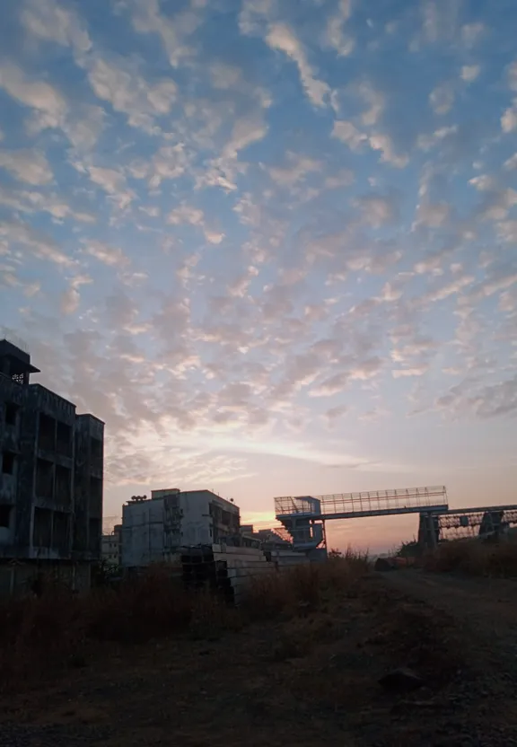 a very tall building sitting on the side of a road