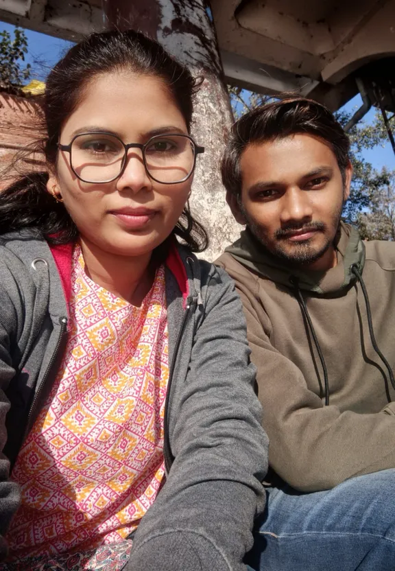 a man and a woman sitting next to each other