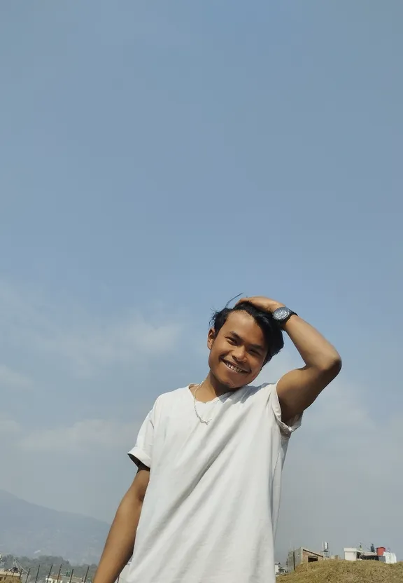 a man standing in a field with a kite in the sky, tree in the background. add a tree in the background