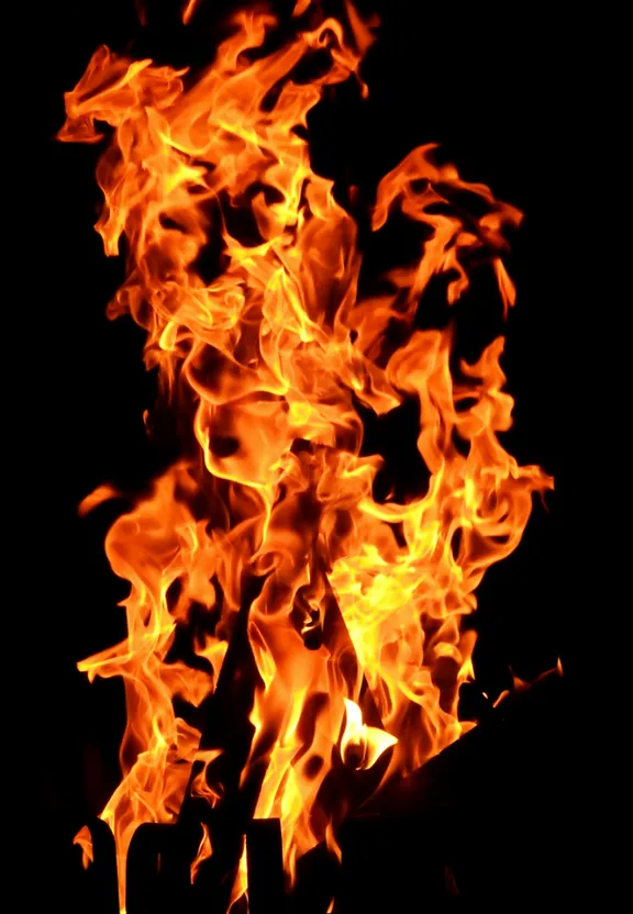 a close up of a fire in the dark