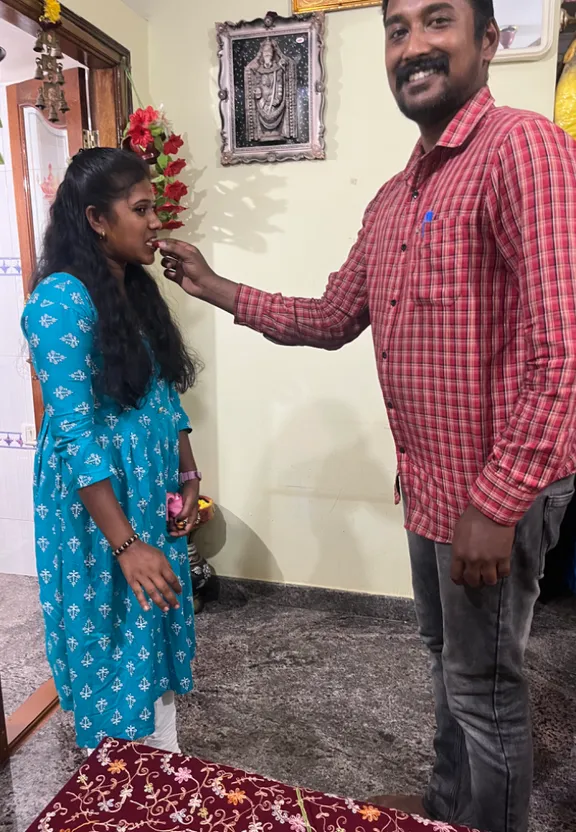 a man standing next to a woman in a room