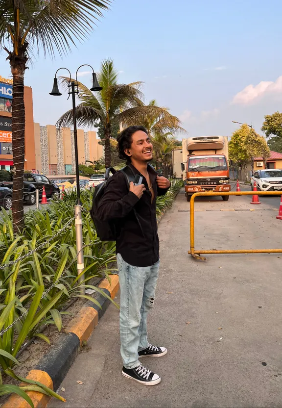 a man standing on the side of a road