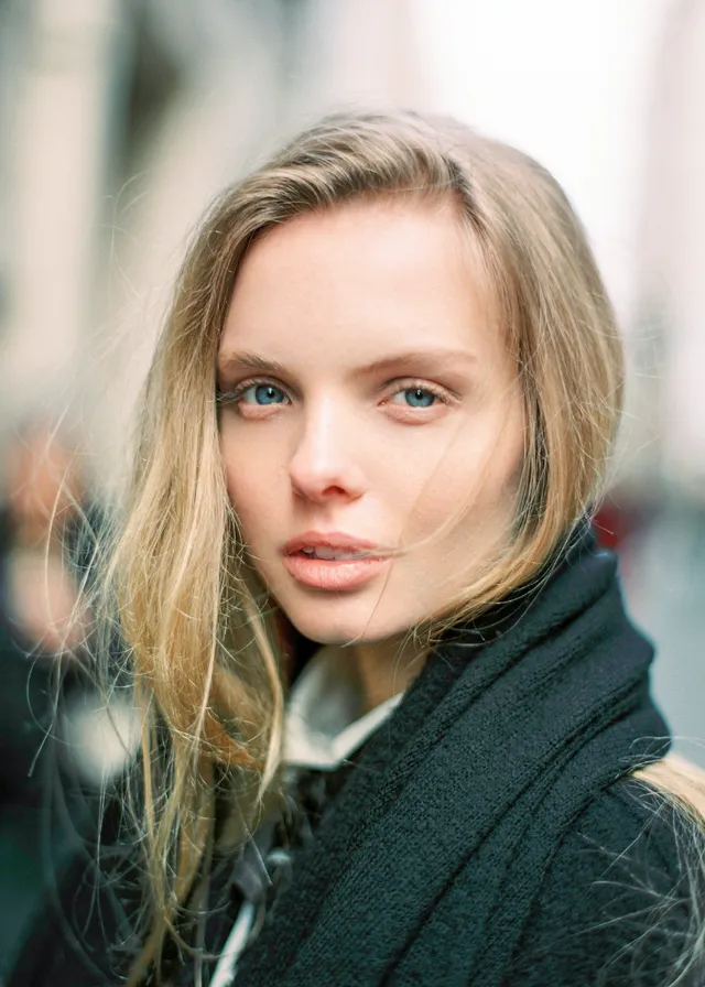 a woman with blonde hair and blue eyes